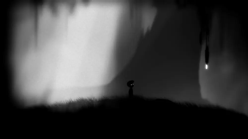 Limbo — a small silhouetted figure walking through a grey forest